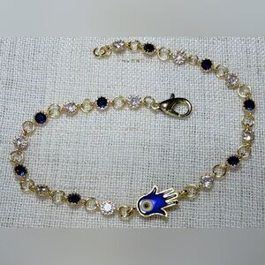 Evil eye bracelet,gold plated clear/blue CZ stones,enamel Hamsa hand charm.7.75”